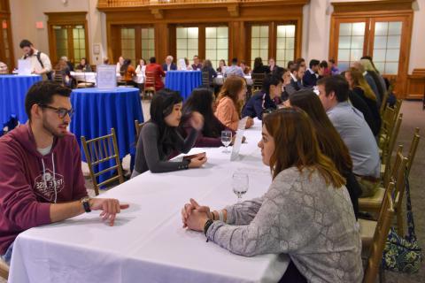 Image of UNH students and Alumni practicing networking skills at No Stress Networking Night