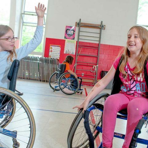 Girls in wheelchairs